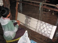 50-The weaving process, the pattern is created with multi colored threads